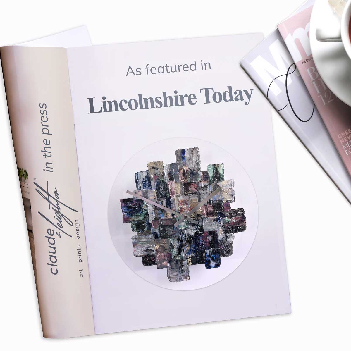 Handpainted round glass wall art clock featured in Lincolnshire Today magazine