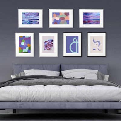 Gallery wall display of violet blue art prints by Claude & Leighton which are perfect to add a splash of Pantone 2022 Very Peri colour to home and office interior colour schemes.